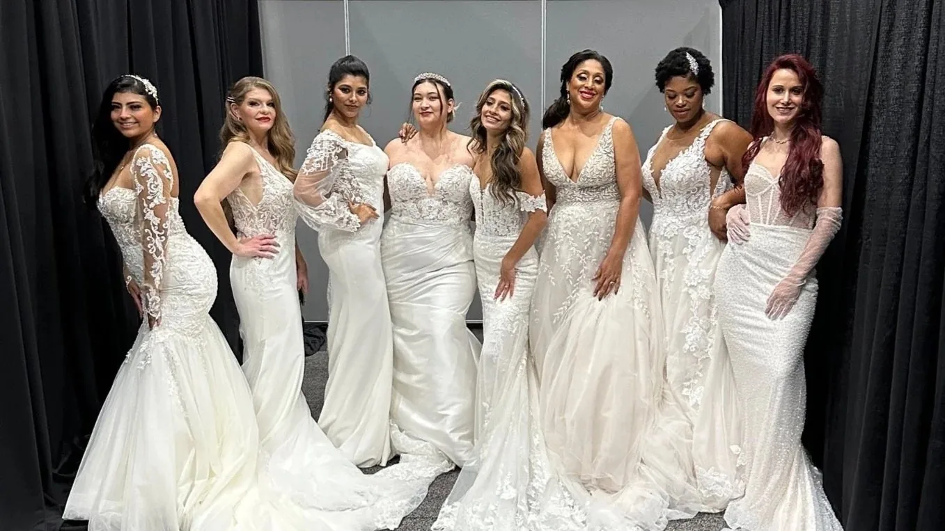 A diverse group of brides in white gowns
