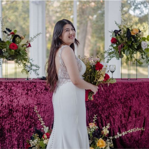 Houston bride holding wedding bouquet florals by All the pretty things htx at The Highlands in Wallisville, Texas.