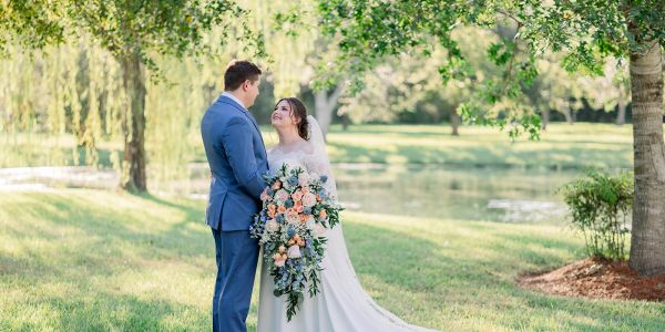 Wedding feature Leah and David at Kemah Gardens Couples photo with bride in Pronovias wedding dress