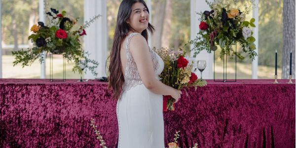 Houston bride holding wedding bouquet florals by All the pretty things htx at The Highlands in Wallisville, Texas.